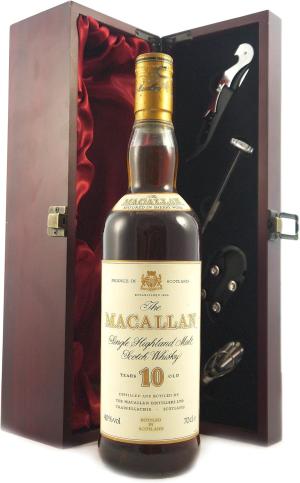 Macallan 10 Year Old Single Highland Malt Whisky 1990s Bottliing in a silk lined wooden box with four wine accessories 1 x 750ml